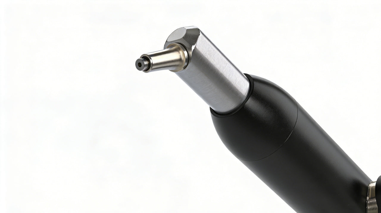 Close-up of replaceable carbide nozzle on dental sand blaster