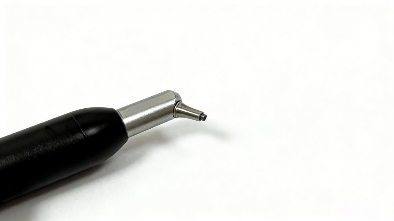 Close-up of angled 0.6 mm dental sand blaster nozzle